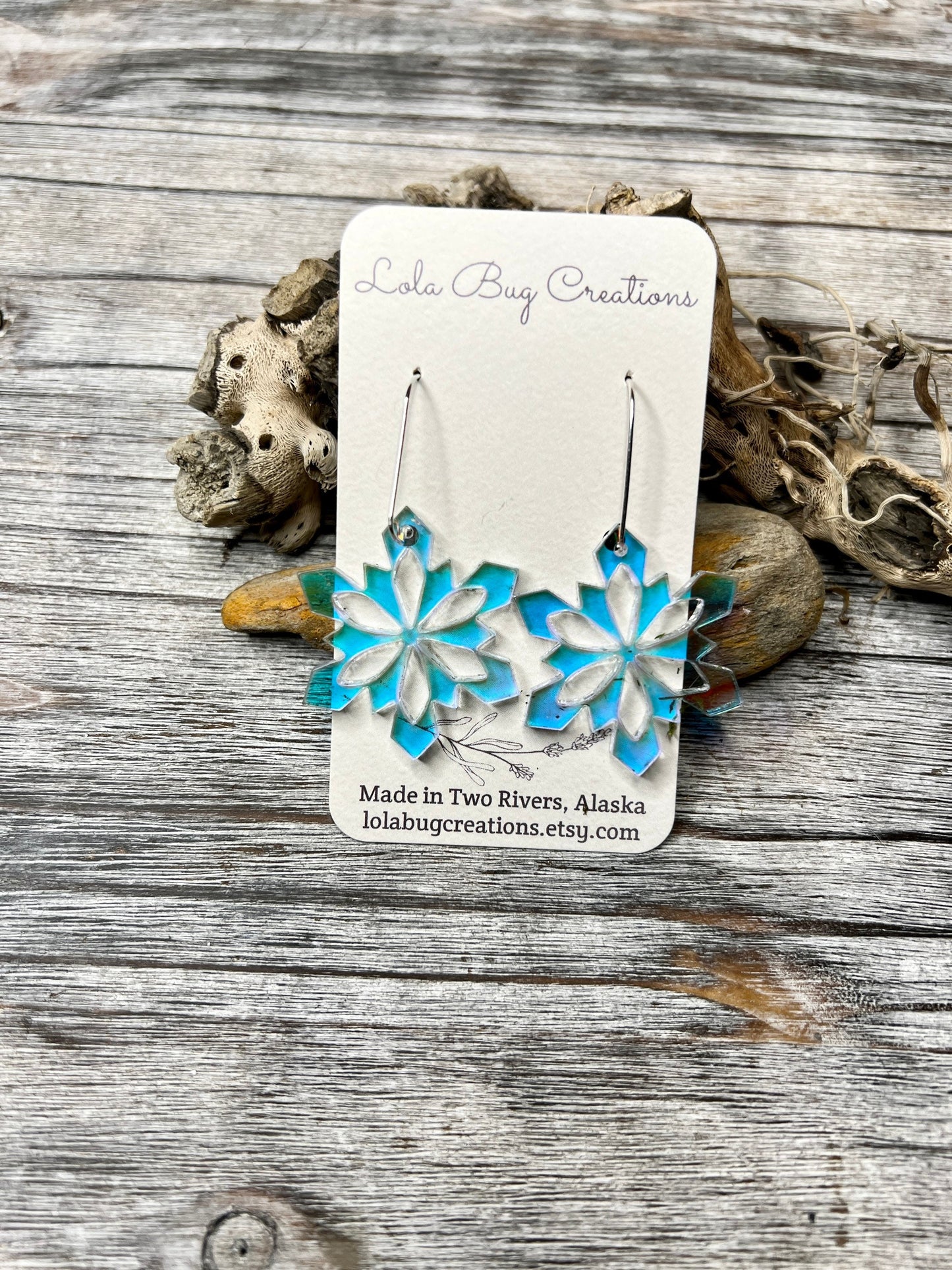 Iridescent snowflake acrylic earrings with sterling silver ear wires