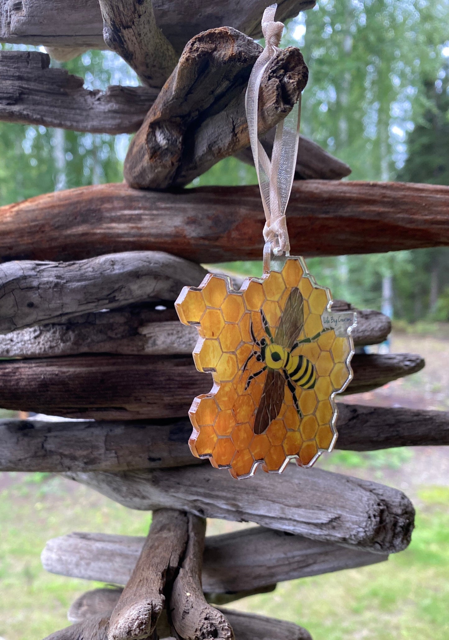 Bee on honeycomb acrylic ornament