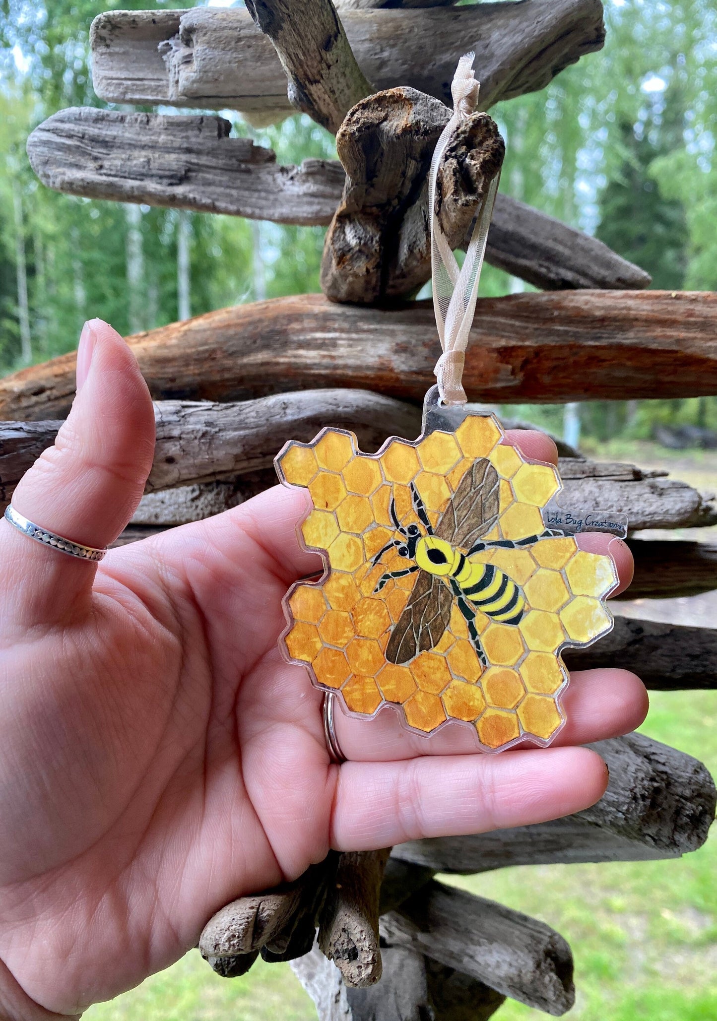 Bee on honeycomb acrylic ornament